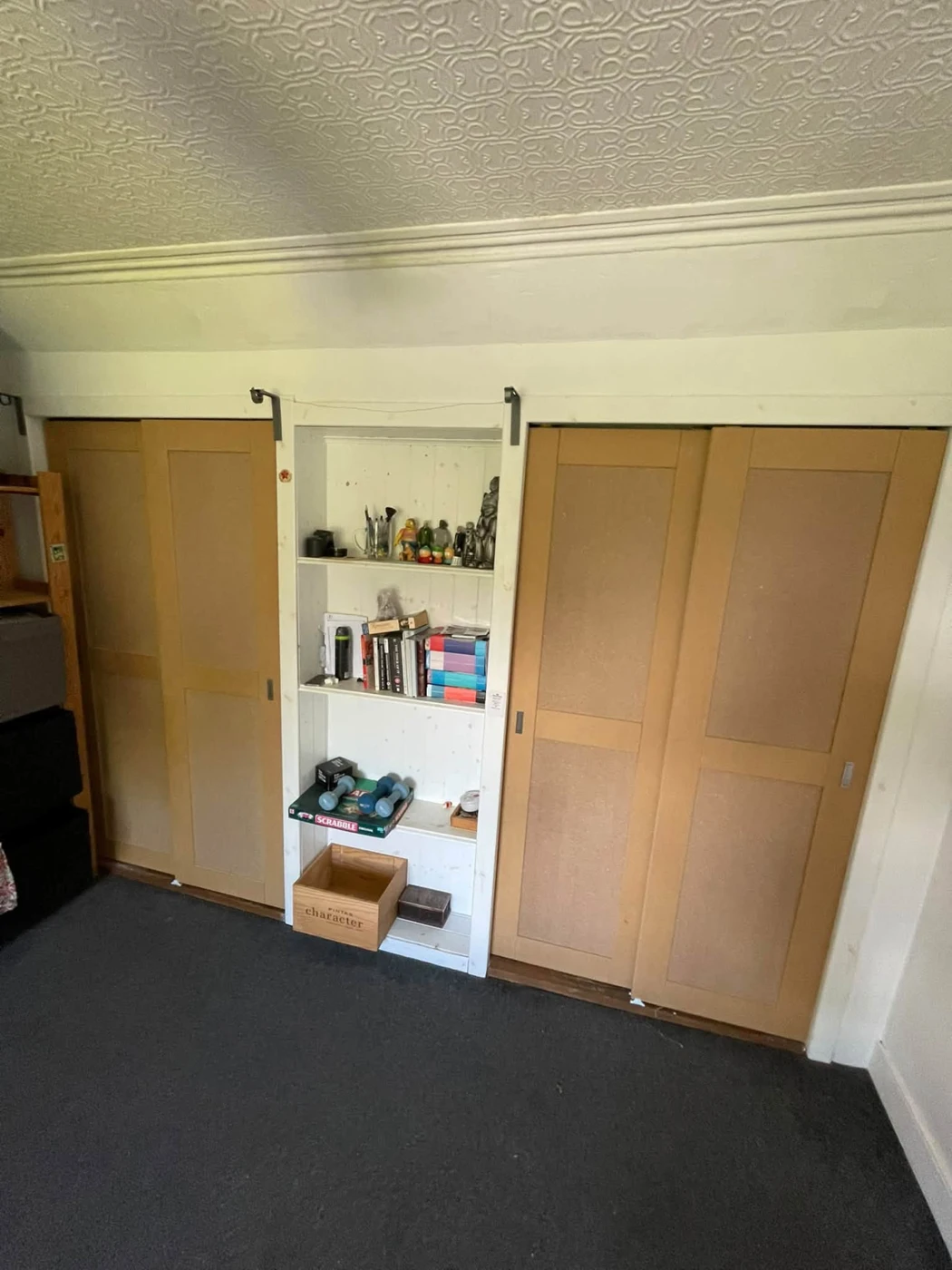 Made-to-measure Shaker-style sliding wardrobe doors, before final decoration